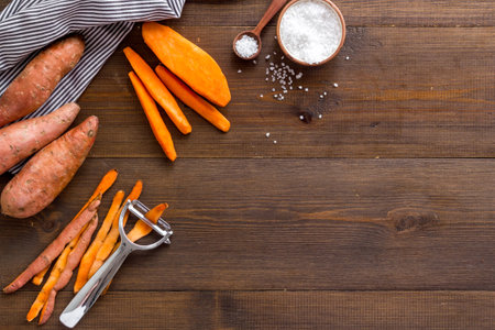 Sweet potato sliced - vegetable vegan food on the kinchen tableの写真素材