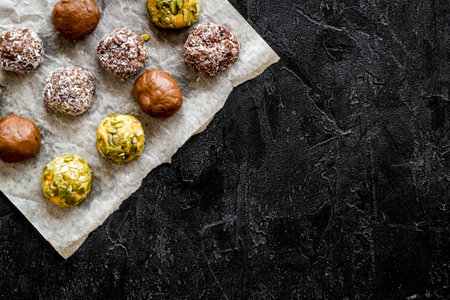 Top view of raw vegan energy balls with nuts and cacao
