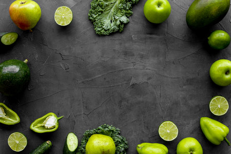Frame of vegetarian food - green vegetables: cucumbers, broccoli, avocadoの写真素材