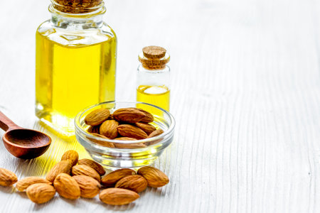 spa with almond oil in organic cosmetic set on white backgroundの写真素材