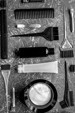 hair dye with brush on gray table background top viewの写真素材