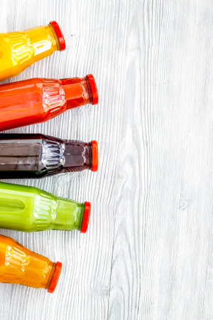 fresh organic juices in bottles for fitness diet on white background top view mock-upの写真素材
