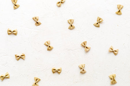 Pasta pattern - colored farfalle, top view. Italian food backgroundの写真素材