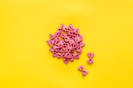 Heap of colored farfalle pasta, top viewの写真素材