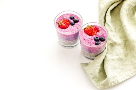 Homemade yogurt chia seeds pudding with strawberries in glassesの写真素材