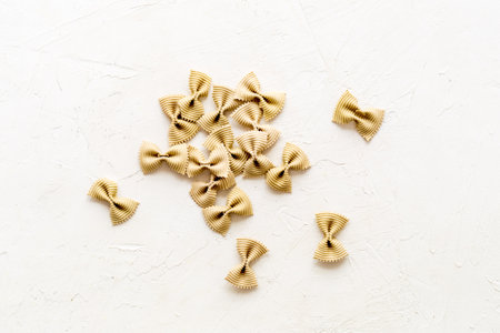 Top view of coloured farfalle pasta, space for textの写真素材