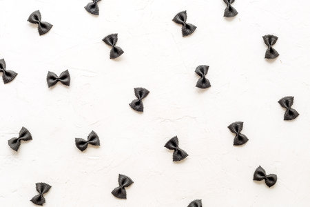 Pasta pattern - colored farfalle, top view. Italian food backgroundの写真素材