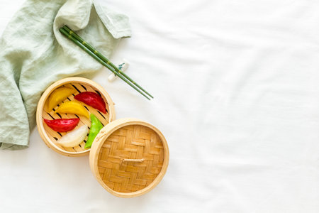 Colored vegetables dumplings totellini in wooden steamer. Traditional Asian foodの写真素材