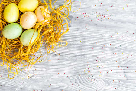 Easter concept eggs in nest top view close up