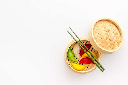 Colored vegetables dumplings totellini in wooden steamer. Traditional Asian foodの写真素材