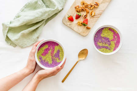 Breakfast Acai smoothie bowles with chia seeds and strawberriesの写真素材