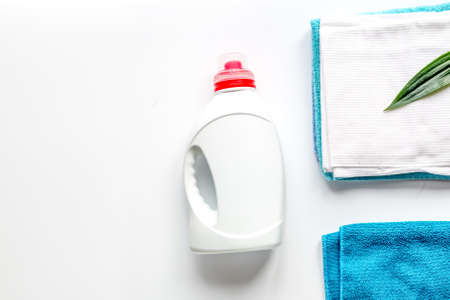 Towels set in laudry with bottles on white backgruond top view mock-upの写真素材