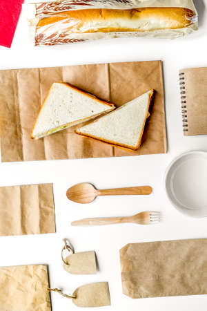 Take away set with paper bags on restourant table background top viewの写真素材