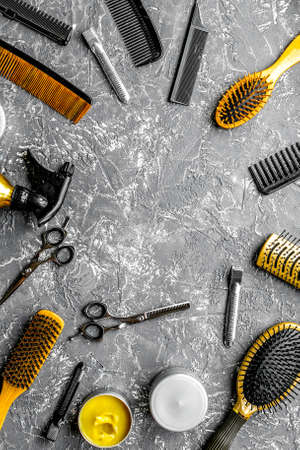 hair cutting preparation with hairdresser tools on desk background top view mockupの写真素材
