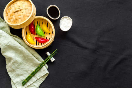 Colored vegetables dumplings totellini in wooden steamer. Traditional Asian foodの写真素材