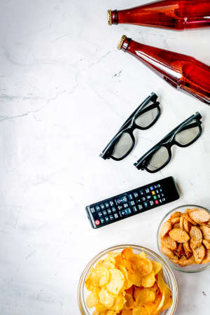 TV control, snacks, beer on white background top view space for textの写真素材