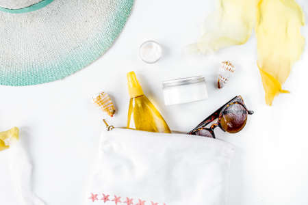 cream and lotion cosmetic for sun protection on white background top viewの写真素材