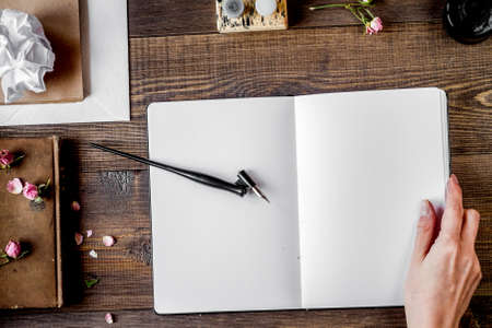 Writer workplace with tools on wooden background top viewの写真素材