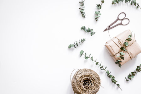 Gift box with flowers on white background top view space for textの写真素材