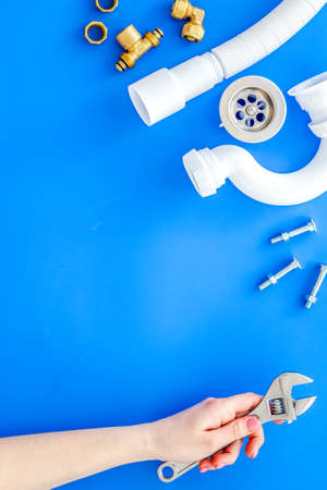 Plumber work with instruments, tools and gear on blue background top view mockupの写真素材