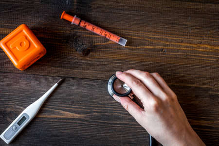 stethoscope, hand, toys on children's doctor office deskの写真素材