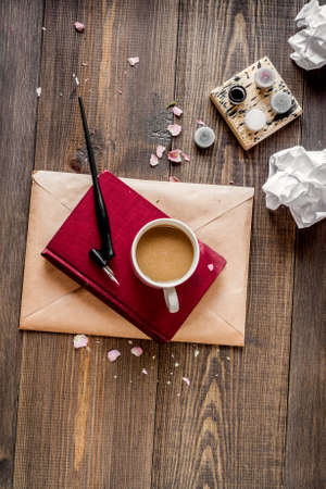writer workplace with tools on wooden background top view mock upの写真素材