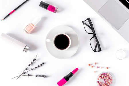 set of cosmetics for women with lavender office background top view