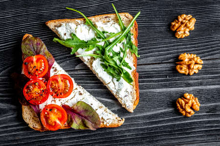 sandwiches set on dark table background top viewの写真素材