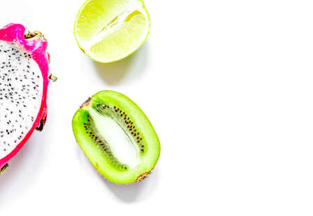 Tropical fruit design on white table background top view space for text