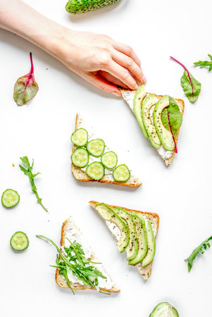 lunch with triangle sandwiches on white table background top viewの写真素材