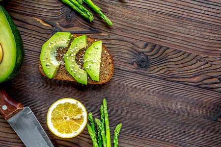 Ingredients for cooking sandwiches with avocado on kitchen table top view mockupの写真素材