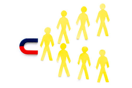 Increase team concept with horseshoe magnet and human figures