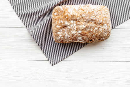 Loaf of rye bread top view. Bread on cutting board