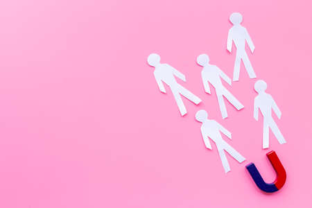 Corporate menegement team concept with horseshoe magnet and human figuresの写真素材