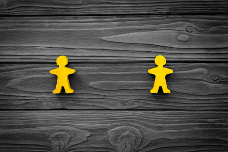 Keep distance concept. Wooden figures on social distancing. Top view