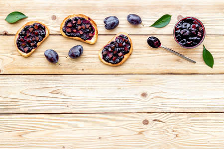 Toasted bread with plump jam. Food layout top view