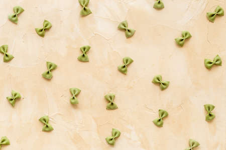 Italian colorful pasta pattern, top view. Various vegan farfalle pastaの写真素材