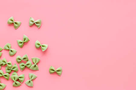 Heap of colored farfalle pasta, top view