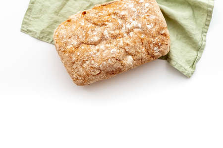 Fresh bread ciabatta loaf top view. Bakery background