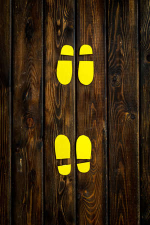 Social distance concept with paper footprints. Top viewの写真素材