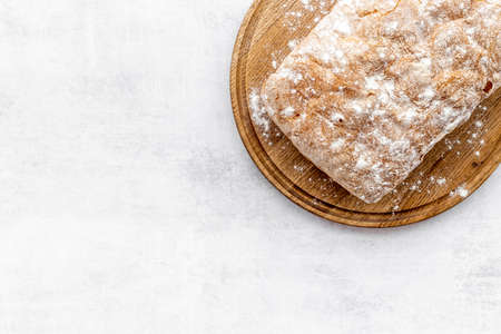 Fresh bread ciabatta loaf top view. Bakery backgroundの写真素材