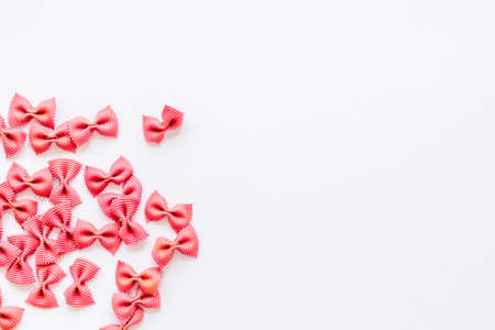 Pasta pattern - colored farfalle, top view. Italian food backgroundの写真素材