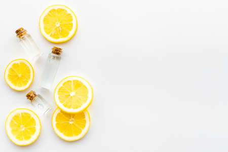 Citrus essential oil vitamin c and lemon slices top view