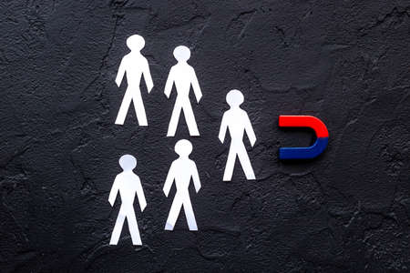 Horseshoe magnet attractives human figures. Increase team and recruiting conceptの写真素材
