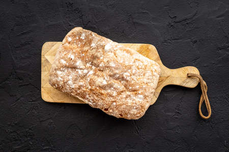 Freshly backed bread top view. Bakery background