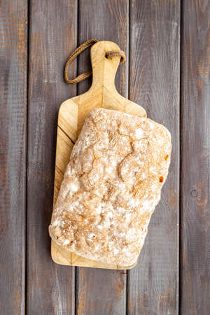 Loaf of rye bread top view. Bread on cutting boardの写真素材