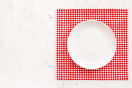Empty plate on napkin - table setting for dinner. Overhead viewの写真素材