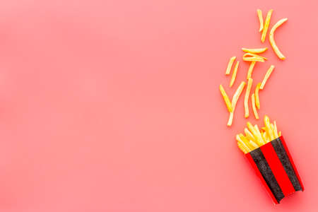 Potatoes french fries in paper box, top viewの写真素材