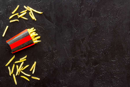 Potatoes french fries in paper box, top viewの写真素材