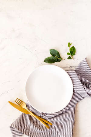 Table setting overhead view - plate with cutlery set and napkinの写真素材